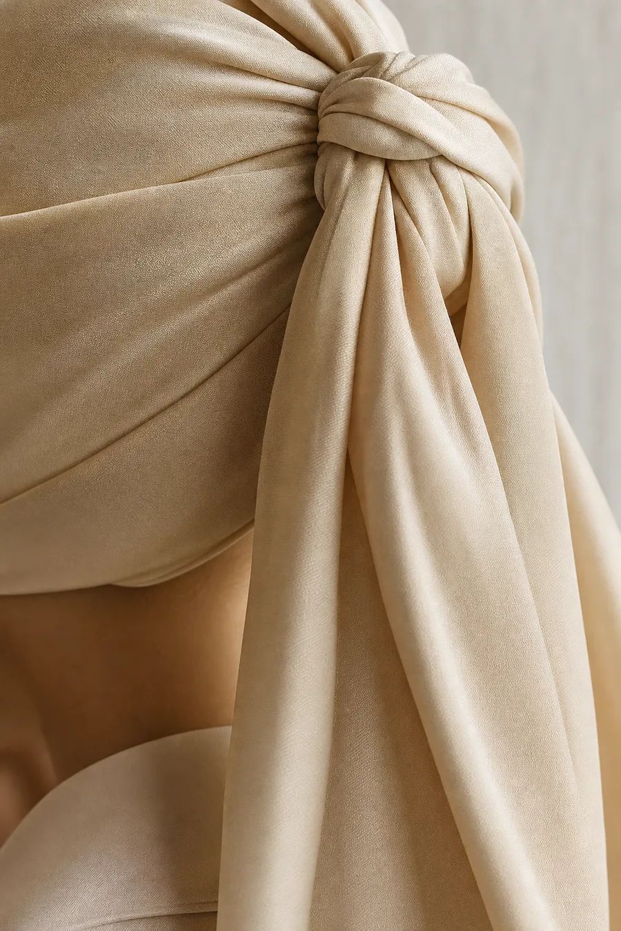 Long silk scarf styled as a head turban, draping elegantly.